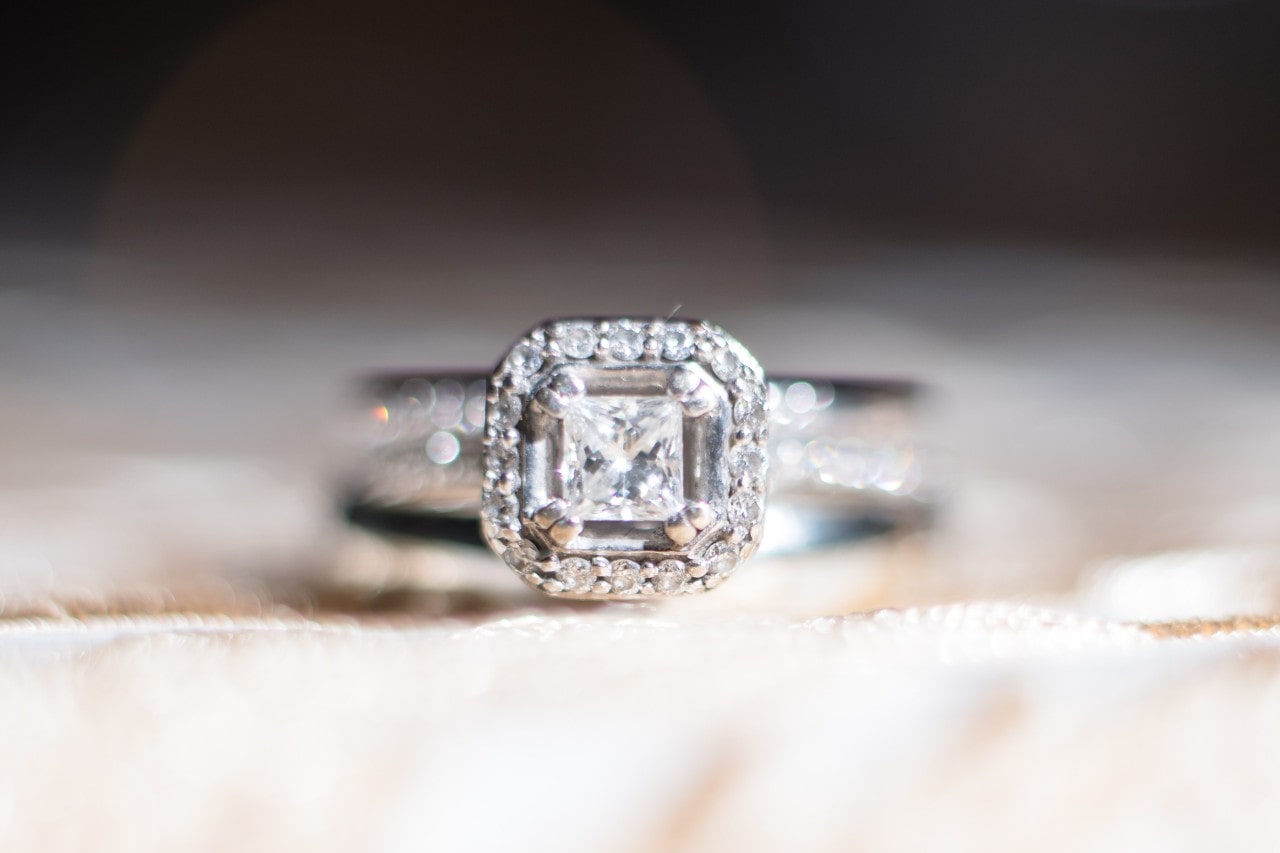 Engagement ring with Asscher cut diamond in a halo setting Engagement ring with Asscher cut diamond in a halo setting