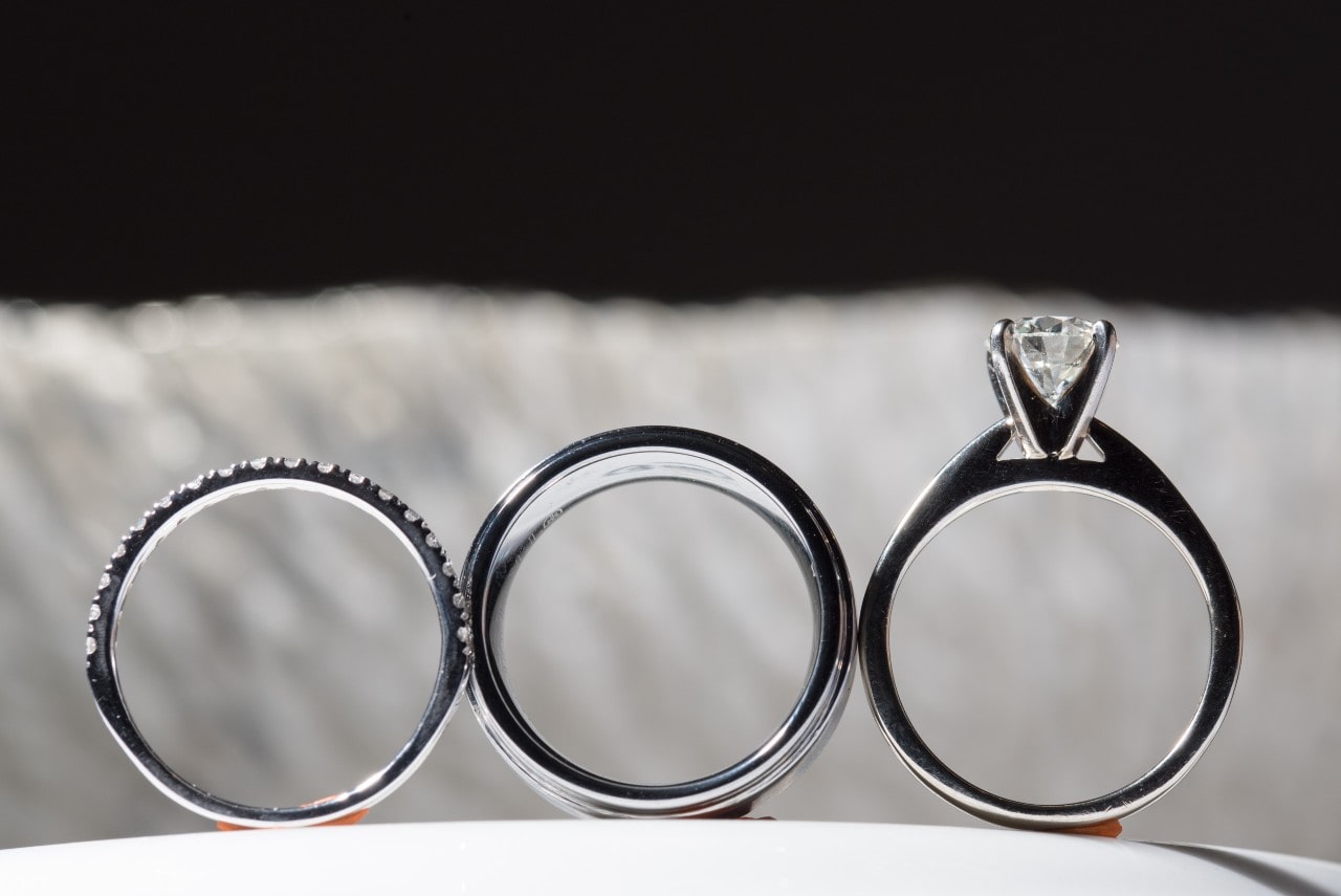 From the left: two wedding bands and a solitaire engagement ring From the left: two wedding bands and a solitaire engagement ring